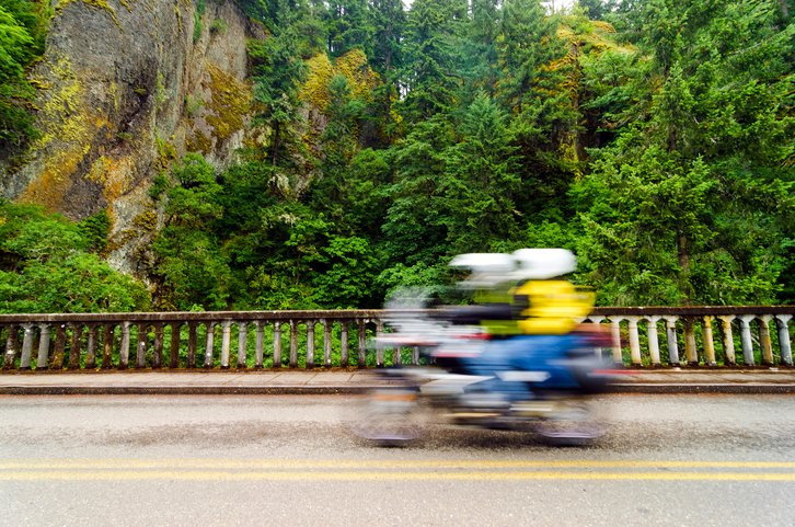 A motorcycle passing by on the scenic highway in the Columbia River Gorge in Oregon